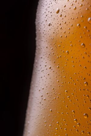 Wet glass of cold pale beer surface texture detailの写真素材