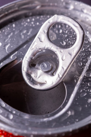 Detail of cold, wet beer bottle with dew and condensate water droplets on the surface of the glass