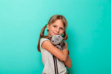 Young woman walking through lavender fields, enjoying the fragrance and colors of beautiful summertime sunset over the blooming meadowの写真素材