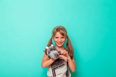 Young woman walking through lavender fields, enjoying the fragrance and colors of beautiful summertime sunset over the blooming meadowの写真素材