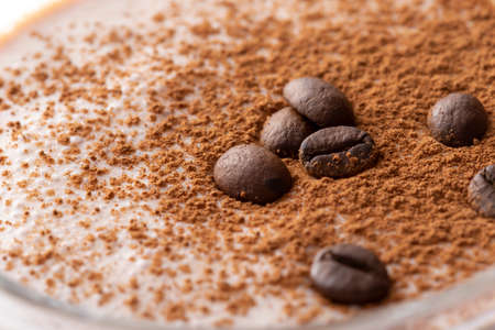 Top view of Irish cream cocktail decorated with coffee beans and sprinkled with cocoa powderの写真素材
