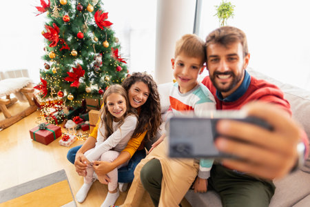 Parents having fun playing with children while spending Christmas at home, blowing party whistles...