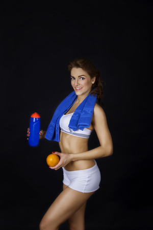 Fitness girl with orangeの写真素材