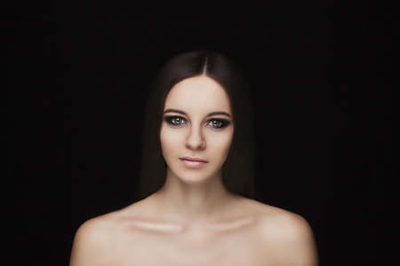 Beauty natural face model with smoky eyes makeup and hair styleの写真素材