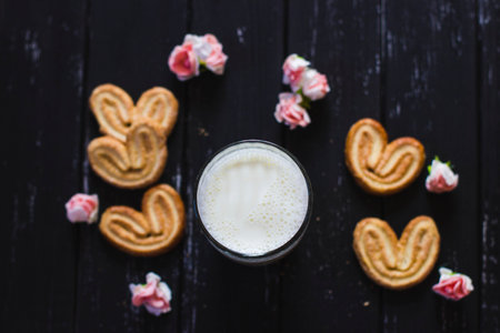 Breakfast on the background of a beautiful texture with milk and cookie