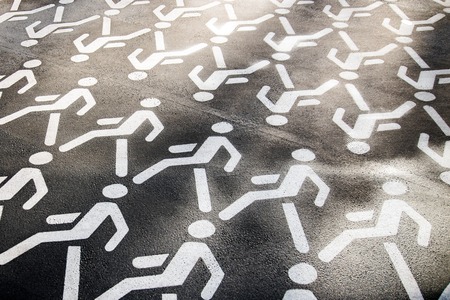 Pedestrian crossing sign on asphalt. The walking man. Permission to walk pedestrians.の写真素材
