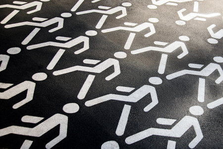 Pedestrian crossing sign on asphalt. The walking man. Permission to walk pedestrians.の写真素材