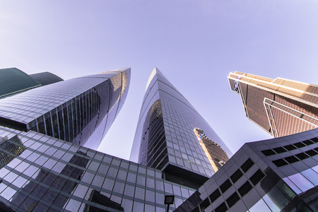 Perspective low angle view of modern glass skyscrapers facadesの写真素材