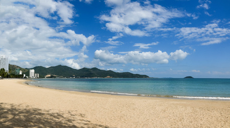 Panoramic view of a tropical beach with blue sky in sunny dayの写真素材