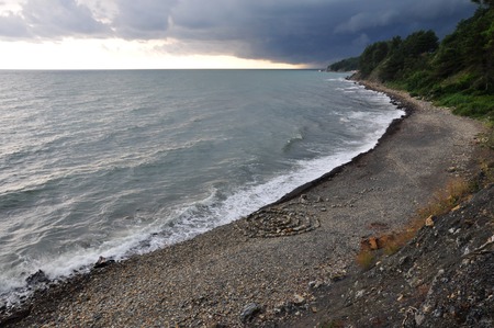 Thunder storm with roll cloud approaching the beachの写真素材