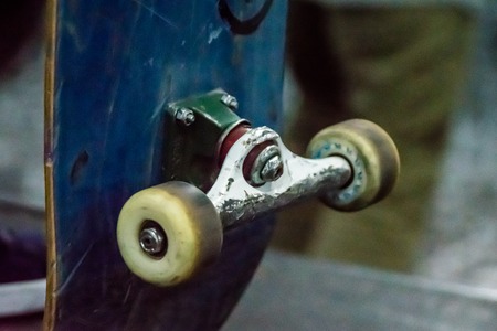 Close up old skateboard detail truck and wheelsの写真素材