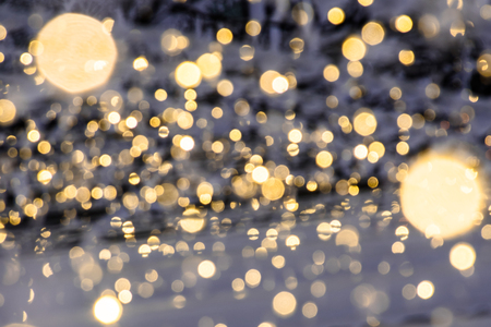 abstract background with bokeh defocused lightsの写真素材