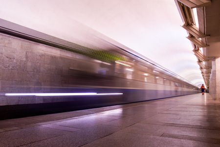 Subway metro train arriving at a stationの写真素材