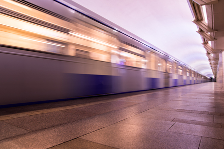 Subway metro train arriving at a stationの写真素材