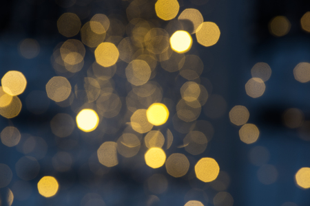 abstract background with bokeh defocused lightsの写真素材