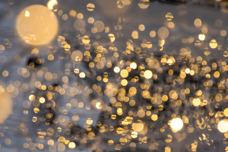 abstract background with bokeh defocused lightsの写真素材