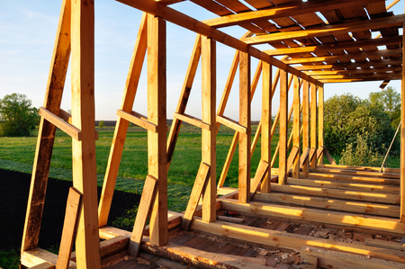 Structure of a wooden house under constructionの写真素材