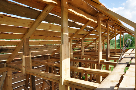 Structure of a wooden house under constructionの写真素材