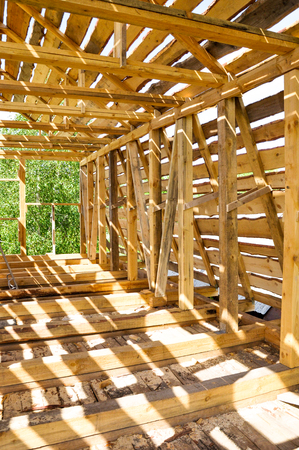 Structure of a wooden house under constructionの写真素材