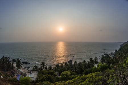 Colorful sunset over the sea and tropical beachの写真素材