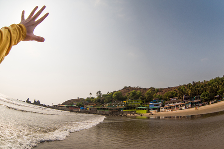 Hand of man holding sun on the sunset skyの写真素材