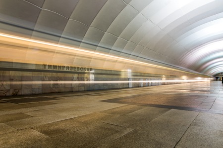 Subway train in motion arriving at stationの写真素材