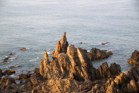 morning sunrise on the sea beach, rocky shoreの写真素材