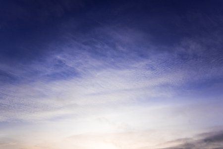 White abstract spindrift clouds on blue skyの写真素材