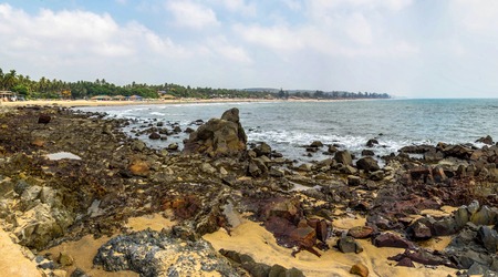 Beauty rocky beach in sunny day with clean meadow skyの写真素材