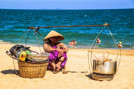 Vietnam, Nha Trang - January 6, 2016: Merchants sell local food to tourists on a beach of the seaのeditorial素材
