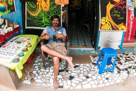 India, Goa, March 24 2017 Seller in street store with fisheye effect on Main road, Arambolのeditorial素材
