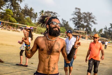 India, Goa, March 25 2017: Happy man on the Arambol beach in indiaのeditorial素材
