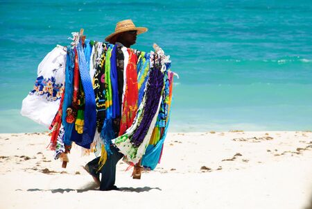 Punta Cana, Dominican Republic - September 16, 2014: souvenir seller on the beachのeditorial素材