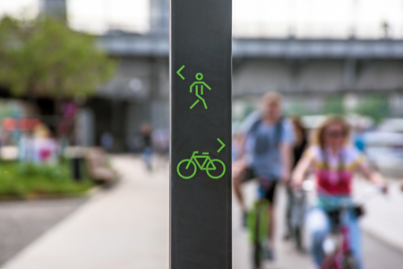 Sign for pedestrians and cyclists in city public park laneの写真素材