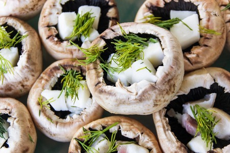Fresh mushrooms champignons with bacon and greensの写真素材