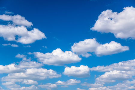 White cumulus clouds in good sunny weatherの写真素材