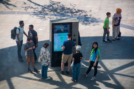 Moscow, Russia - May 13, 2018: People at an information stand in a public park Zaryadyeのeditorial素材