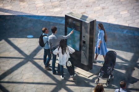 Moscow, Russia, May 13, 2018: People at an information stand in a public park Zaryadyeのeditorial素材