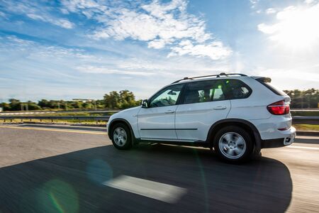 White suv on the road with speed effectのeditorial素材