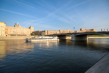 Moscow, Russia - September 5, 2018: Moscow river with cruise boat and bridgeのeditorial素材