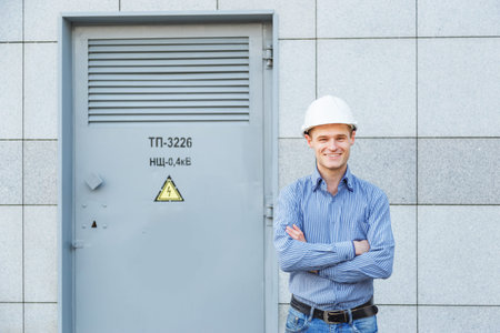 Portrait of young engineer in helmet
