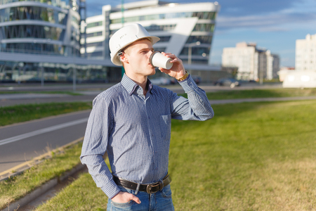 Builder or construction worker enjoying a cup of coffee near the siteの写真素材