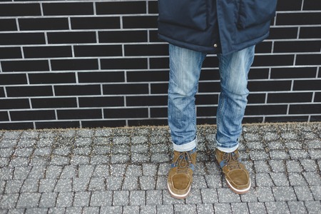 Men fashion, brown leather boots and blue jeansの写真素材
