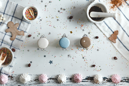 Jars of candy in the center of the table with cookies and sweets. View from above.の写真素材