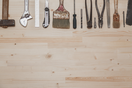 Set of different tools on wooden backgroundの写真素材