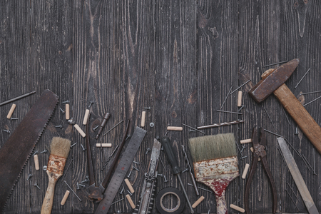 Set of different tools on dark wooden backgroundの写真素材