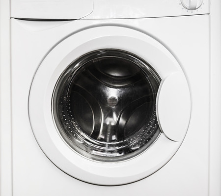Close-up of a closed door empty washing machine.の写真素材