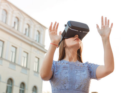 Young Woman enjoy with VR device outdoor