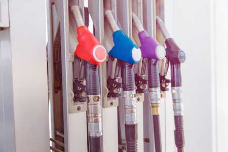 Fuel pump with gasoline and diesel handles dispenser at petrol filling station.の写真素材