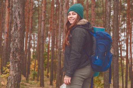Hiking woman portrait smiling happy in forestの写真素材